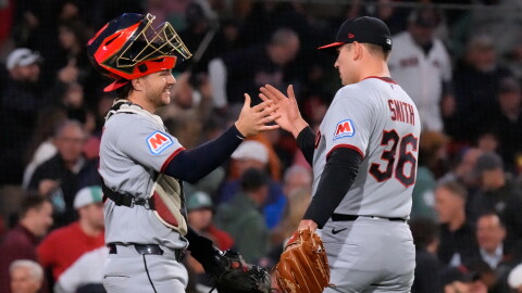 Cleveland Guardians' Cade Smith (36) is congratulated by Patrick Bailey after clinching a post season playoff spot following a baseball game against the Boston Red Sox, Thursday, Sept. 24, 2026, in Boston. 