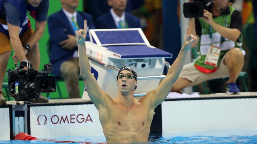 Michael Phelps celebrates winning the gold medal in the 200-meter butterfly on Tuesday night. In taking his 20th Olympic gold, Phelps also avenged a narrow loss in the event in 2012 to South Africa's Chad le Clos, who finished fourth.