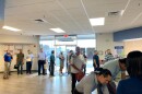 Job seekers line up a hiring event at