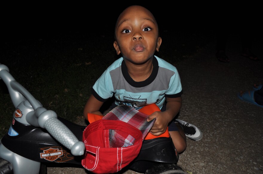 Charles Lane, 3, makes faces for the camera during an evening walk in September of 2014. 