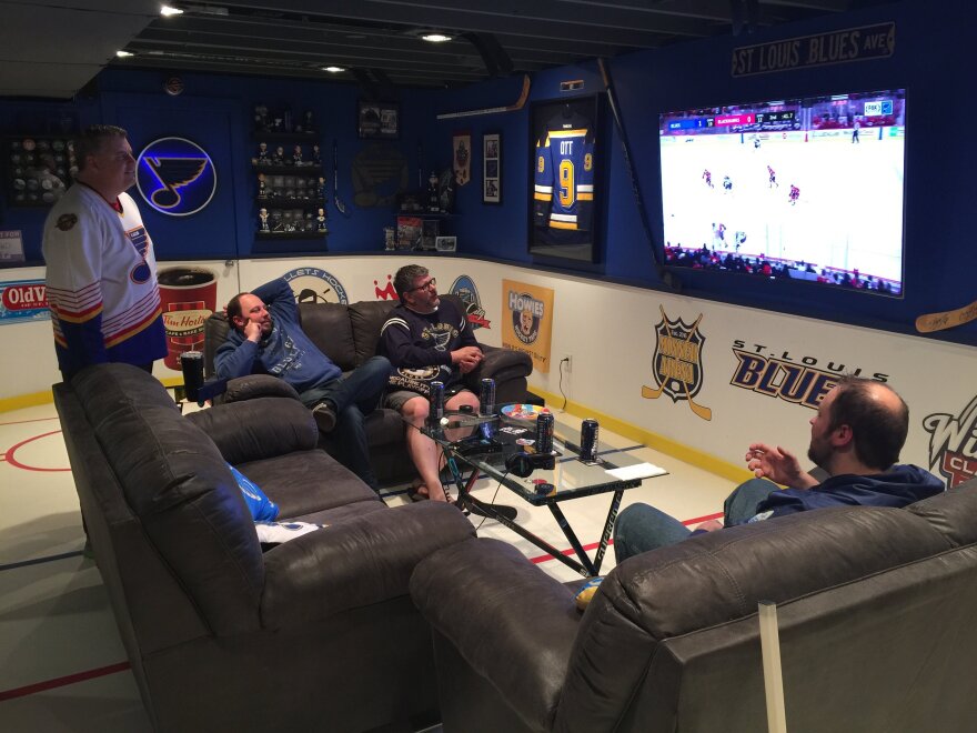 Dennis Minner and friends gather to watch a recent Blues game in this basement that has been converted into a mini-Scottrade Center. March 2018