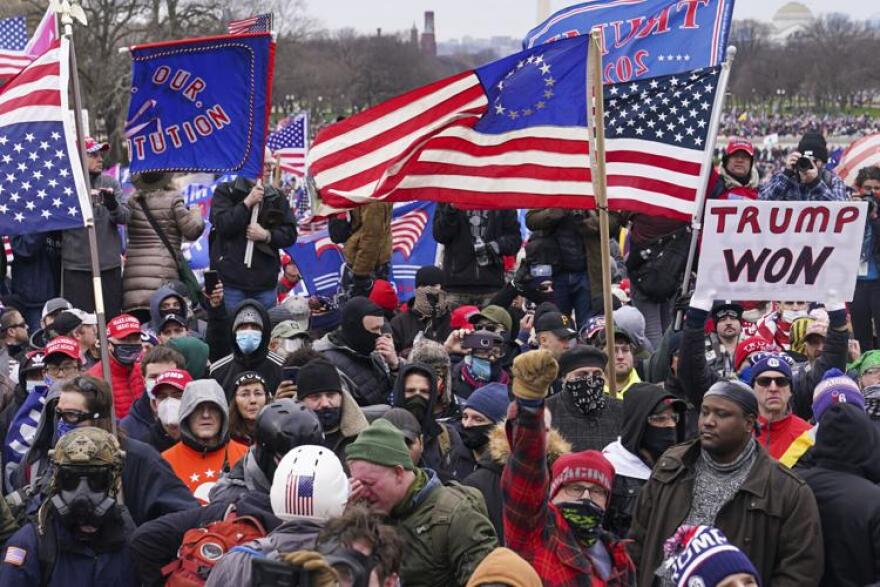 Rioters are seen at the U.S. Capitol on Jan. 6, 2021 in Washington. The Supreme Court will decide whether former President Donald Trump can be kept off the 2024 presidential ballot because of his efforts to overturn his 2020 election loss that culminated in the Capitol attack.