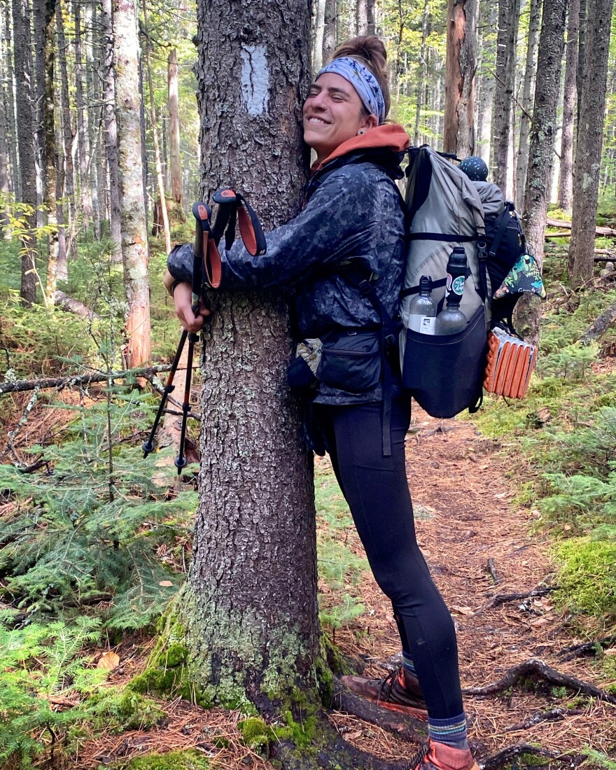 Jocelyn Smith hugging a tree on the Appalachian Trail