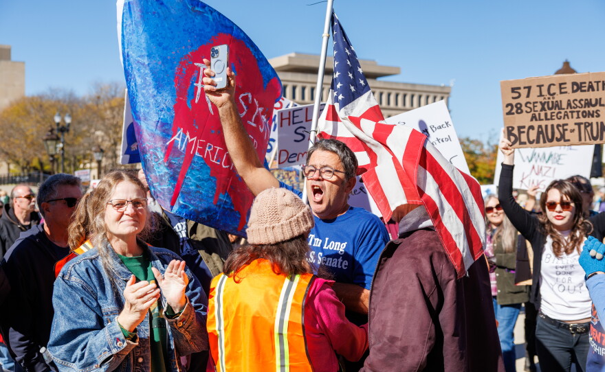 Tim Long, the U.S. Taxpayers Party nominee for U.S. Senate, protests the fourth No Kings rally in Lansing, Mich., on Oct. 17, 2026.