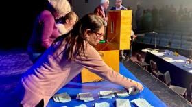 Bow Town Clerk Mridula Naik and others count the votes cast by secret ballot at the 2026 town meeting.