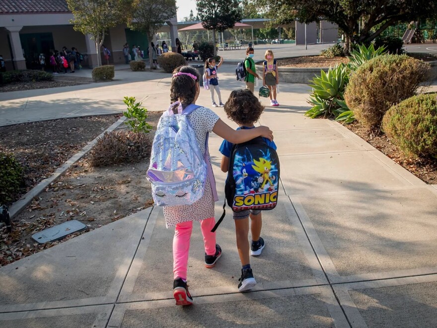 Students make their way to class for the first day of school at Tustin Ranch Elementary School in Tustin on Aug. 12, 2021.