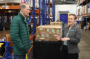 U.S. Sen. Ron Wyden (left) tours Food For Lane County’s warehouse with FFLC's Rebecca Sprinson (right). Sprinson said increased demand is expected through the holiday season.