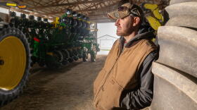 Jake Lieb with his John Deere equipment on Monday, March 18, 2024, at his farm near Monticello, Ill.
