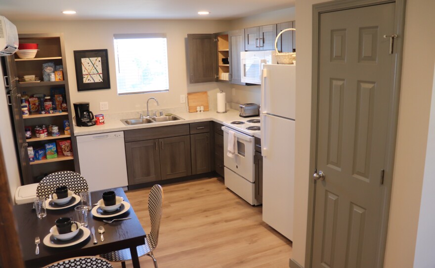 Saranam executive Director Tracy Weaver and Alumni Coordinator Leighann Plummer, an alumna herself, gave U.S. Sen. Martin Heinrich a tour of their new west side campus, including a model apartment that shows what families can expect when they move in.