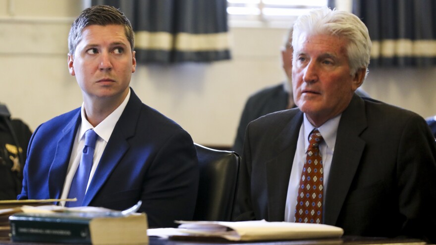 Former University of Cincinnati police officer Ray Tensing, left, faces a murder charge over the death of Sam DuBose. Tensing is seen here during his retrial Friday at the Hamilton County Courthouse in Cincinnati.