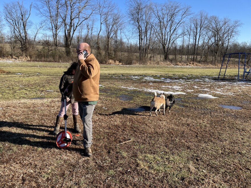 Micah Seavers on his Graves County property with his daughter.