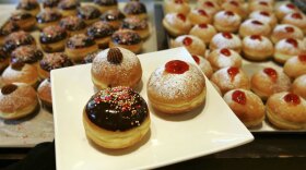 Jews commemorate Hanukkah by eating fried foods. For most American Jews, that means latkes — potato pancakes fried in oil. But other cultures toss different foods into pots of boiling oil. Take, for example, these fried and jam-filled doughnuts, called <em>sufganiyot</em> in Hebrew, on display at a bakery in Kadima in central Israel.