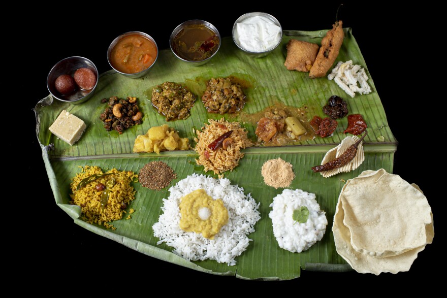 An Andhra-style platter is neatly arranged with an assortment of curries, fried vegetables, <em>pappu</em> (lentils), <em>sambar</em> (a lentils-based spicy stew), <em>rasam</em> (a tangy spiced broth), <em>perugu</em> (yogurt), pickles, chutneys, spicy "gun powder" and  <em>ghee —</em> clarified butter that can be found in most South Asian cuisines.