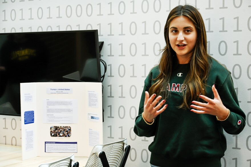 Quinnipiac University student Melody Saboori presents her topic on presidential immunity during American Constitutional Law class on December 4, 2025. Saboori said the recent Supreme Court decision stating presidents have immunity in office is concerning. But she said the constitution still matters. " I don't know if I'm just an optimistic person, but I have faith. I have full faith in our country, because I have full faith in people. And I think at the end of the day, there are so many people that love our country, and I'm one of them,."