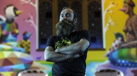Co-founder Lee Molloy stands in the chapel of the International Church of Cannabis. The building is a former church found on Logan Street in Denver. (Corey Jones/CPR News)