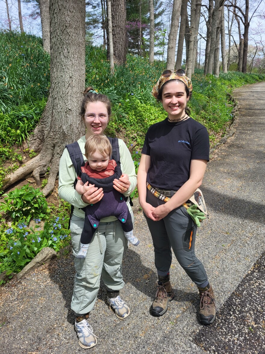 Sisters-in-law Rachel and Susan Havern and 10-month-old Silvie, join in on the invasive plant removal at Aullwood Garden's Big Pull, experiencing the satisfaction of contributing to the restoration of native plants.