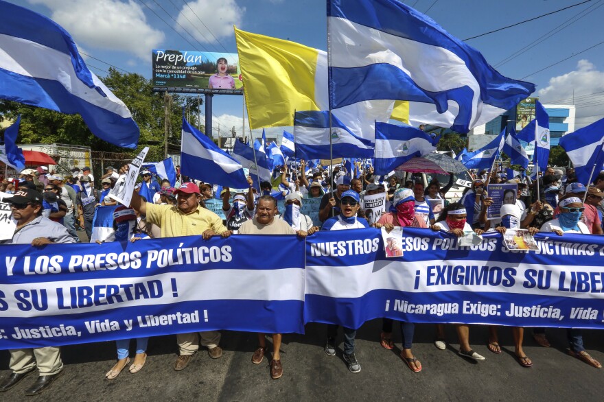 Demonstrators march to demand freedom for political prisoners in Managua on Aug. 11. The ongoing unrest in Nicaragua began in April, when President Daniel Ortega announced cuts to the social security system and small protests by senior citizens were violently broken up.