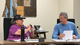 ntrim County Clerk Victoria Bishop, left, speaks with District 5 commissioner Ray Scola during a meeting in July 2026 in Bellaire. (Photo: Hayley Harding / Votebeat)