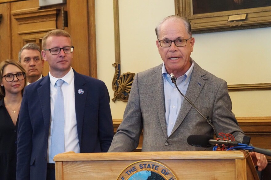 From left: Alex Adams, U.S. Assistant Secretary of Administration for Children and Families, listens as Gov. Mike Braun makes an announcement benefiting foster children at the Indiana Statehouse on Wednesday, May 13, 2026.