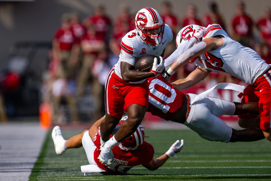 Western Kentucky running back Ajay Allen (3) runs the ball up the sideline during the first half of an NCAA college football game against Indiana, Saturday, Sept. 19, 2026, in Bloomington, Ind.