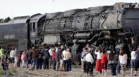 FILE, May 4, 2024 - Train enthusiasts gather to get a look at Big Boy No. 4014, one of the world's largest steam locomotives, Sunday, May 4, 2014, in Salt Lake City. Twenty-five Big Boys were built exclusively for Union Pacific Railroad. Big Boy No. 4014 was delivered to Union Pacific in December 1941. The locomotive was retired in December 1961, and is being taken to Cheyenne, Wyo., for restoration, that is anticipated to take three to five years. 