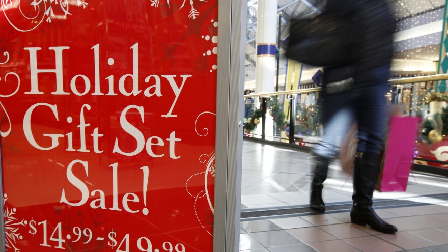 A retail store at the CambridgeSide Galleria mall in Cambridge, Mass., advertises holiday sale, Monday, Dec. 24, 2012.