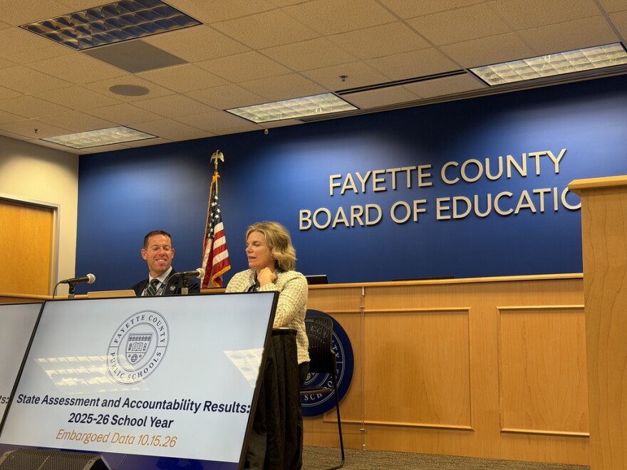 Fayette County Public Schools Interim Superintendent Dr. Bill Bradford, left, and Director of Assessment Dr. Brooke Stinson, right, present an overview of 2025-26 state performance test scores during a news briefing at the John D. Price Administration Building Oct. 14, 2026.