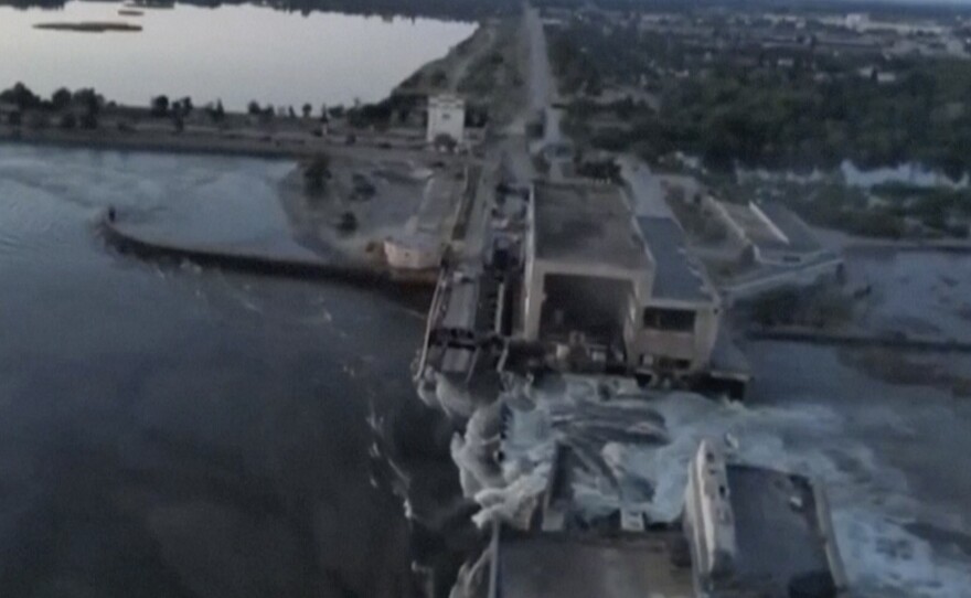 This image made from video provided by Ukraine's Presidential Office shows the damaged Kakhovka dam near Kherson, Ukraine, Tuesday, June 6, 2023. Ukraine on Tuesday accused Russian forces of blowing up a major dam and hydroelectric power station in a part of southern Ukraine that Russia controls, sending water gushing from the breached facility and risking massive flooding. (Ukraine's Presidential Office via AP)