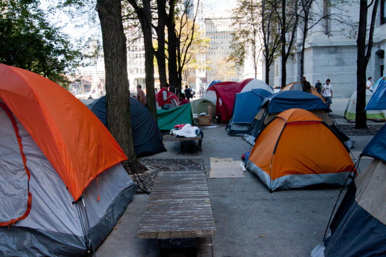 A tents sits out in a public space.