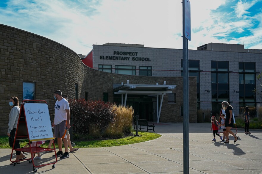 Students were assigned entrances at Prospect Elementary School based on their grade to cut down on unnecessary contact. They will stay in the same classroom all day. Many parents drove their kids to school to cut down on exposure to kids outside their coh