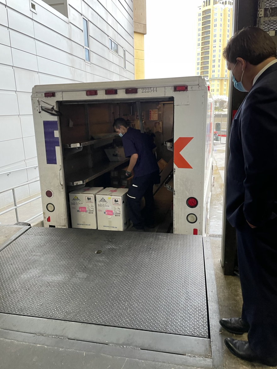 Gov. Ron DeSantis said he signed for the vaccine packages when FedEx delivered them in Tampa on Monday.