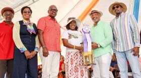 Pictured: Officials pose with the 2026 Produce Farmer of the Year Claritta Montoute, during the 54th Annual Agriculture and Food Fair Opening Ceremony