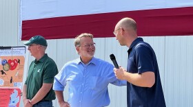 Gary Peters speaks with the owner of Crossroads Blueberry Farm, as the spotted wing drosophila has been attacking fruit farms across the country