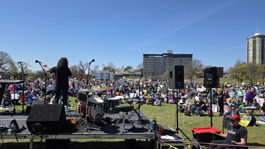 Stacey Woolley (on stage), a member of the Tulsa Public Schools board, addresses a crowd at Dream Keepers Park as part of Tulsa's third "No Kings" protest on March 28, 2026.
