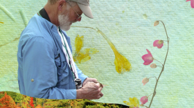 Custom graphic of vibrant colors and John Latimer looking at a plant.