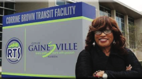 Corrine Brown smiles in front of a building for which she helped to find federal funding and was then named in her honor. (Courtesy City of Gainesville)