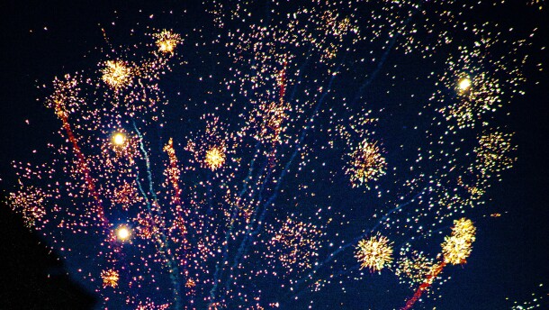 Fireworks exploding into the night sky.