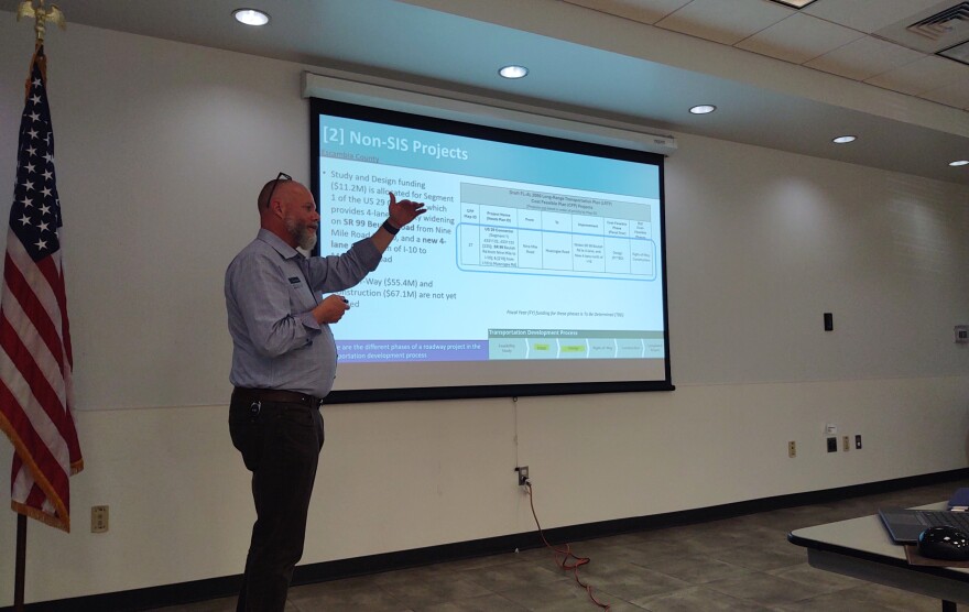 At a recent public workshop, Cory Wilkinson, senior planner with engineering firm HDR, explains funding projections for projects currently included in the Draft FL-AL 2050 Long Range Transportation Plan. It's the Cost Feasible Plan portion of the planning process.