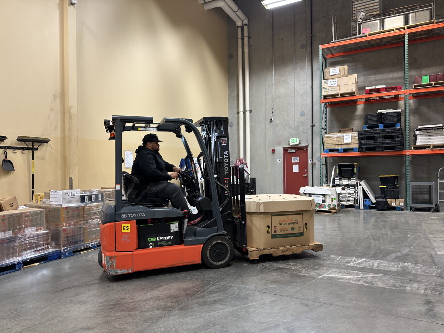Inside the Food Bank of Northern Nevada’s warehouse, Elton Lintz drives a pallet jack to load up his semi-truck with pallets of fresh produce, canned goods, frozen meats, and bread.