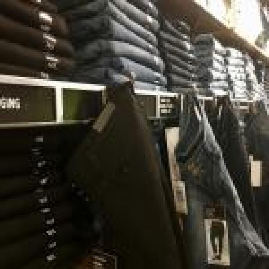 wall of blue jeans inside store