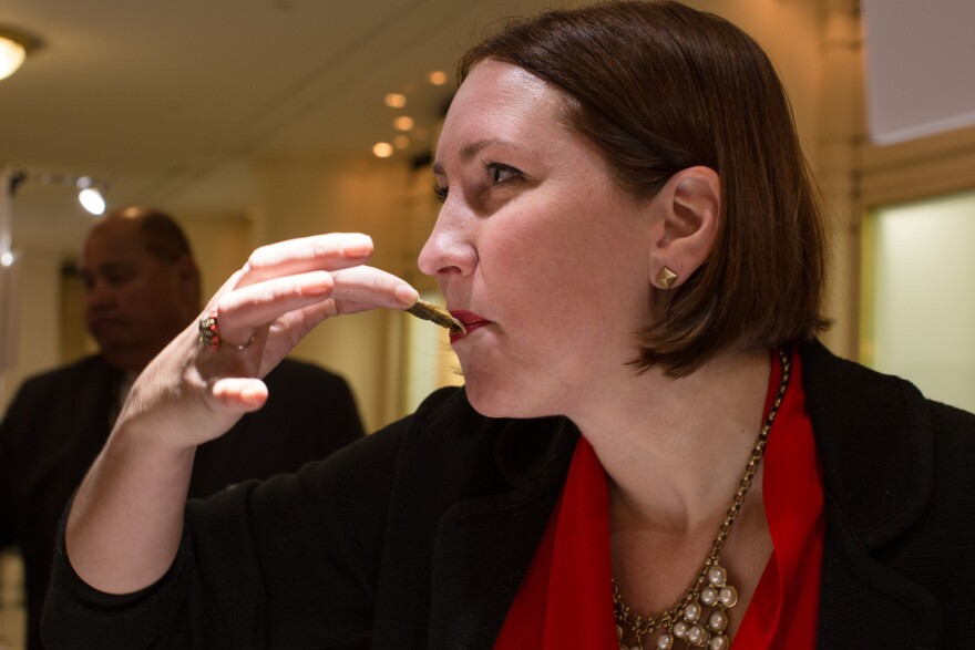 April Fulton eats an oyster the proper way: by kissing it off the shell.