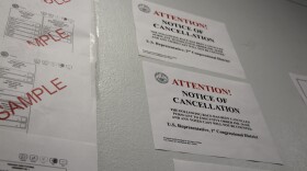 A sign alerting voters to the cancellation of the U.S. House primary race in Louisiana is hung up next to a sample ballot during early voting at the New Orleans City Hall on Tuesday, May 5, 2026.
