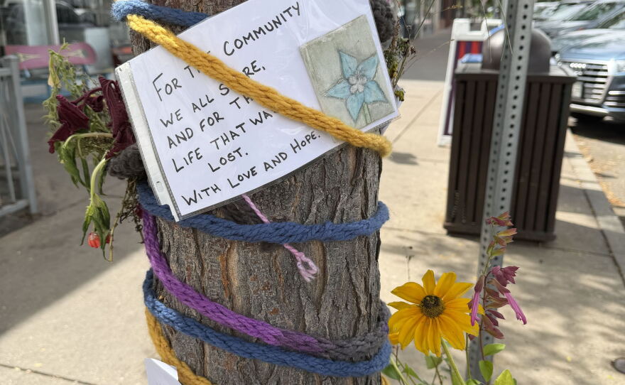 Notes on a tree and flowers below.