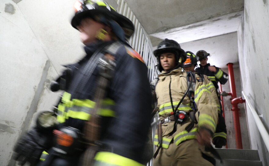 Firefighters participate in the 9-11 stair climb on Navarre Beach.