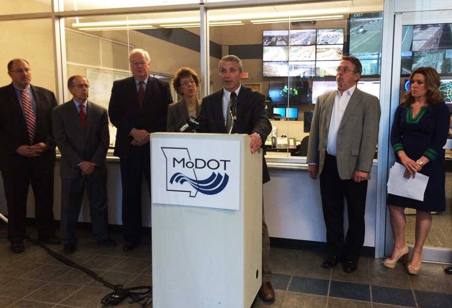 MoDOT District Engineer Greg Horn speaks at the TRIP report news conference Thursday, April 30, 2015 against a backdrop of the traffic management center in Chesterfield.
