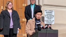 Megan Stoner, left, and Rep. Chris Chyung (D-Dyer), at lectern, support lowering the age limits to serve in the Indiana General Assembly.