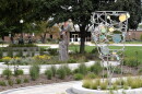 The sculpture garden at One Normal Plaza now has five pieces installed along new curvilinear paths. The garden is designed around an existing sculpture unveiled in 2008 as a tribute to the Illinois Soldiers and Sailors Children's School.