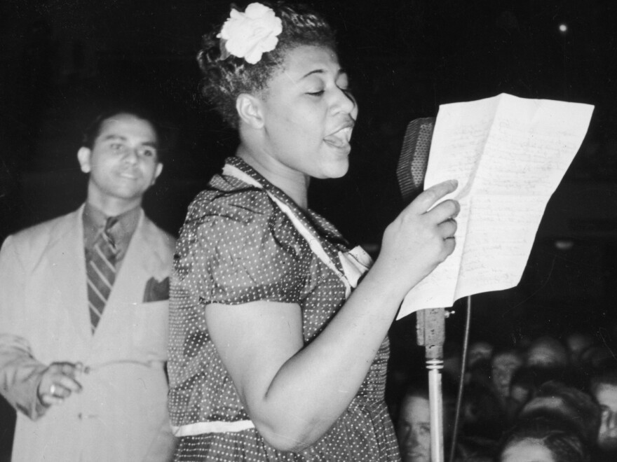 Ella Fitzgerald sings with bandleader Chick Webb in Asbury Park, N.J., in 1938.