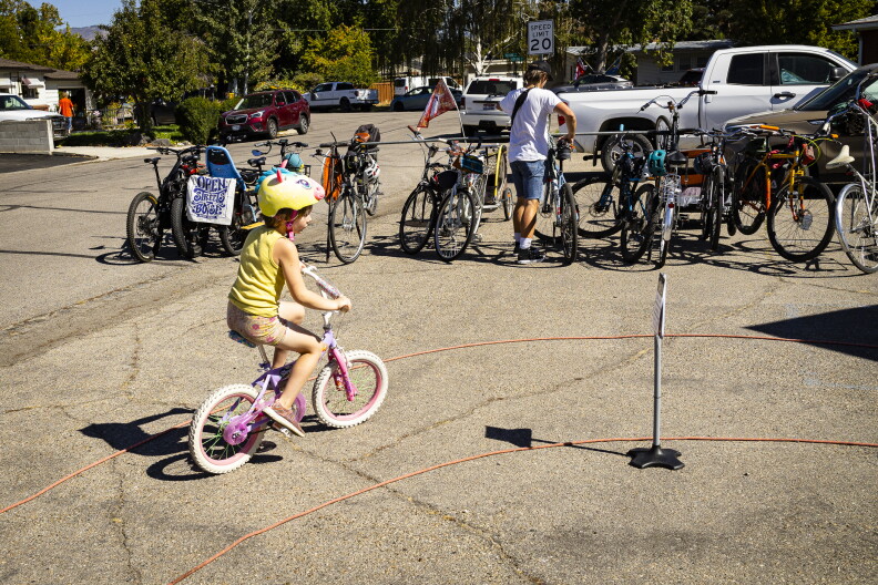6-and-a-half-year-old Margot Mace makes her way around a bicycle skills course. 