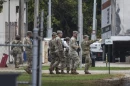 Members of the Texas National Guard assemble at a training center in southwest suburban Elwood Tuesday.